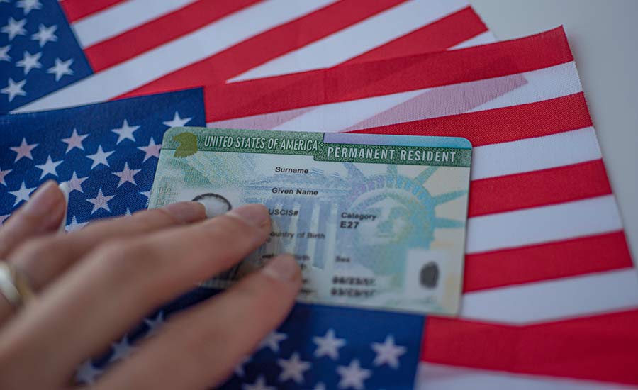 A Green Card and the U.S. flag