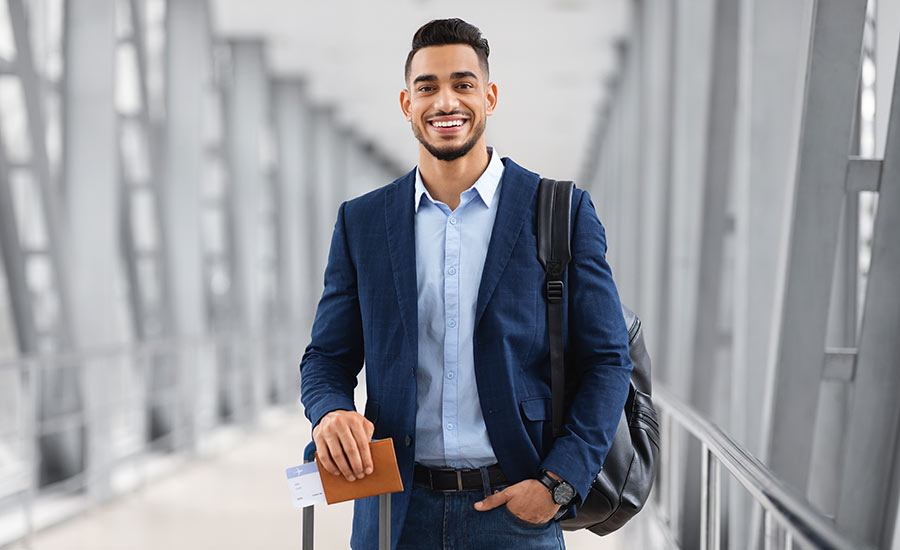 A young smiling man at the airport