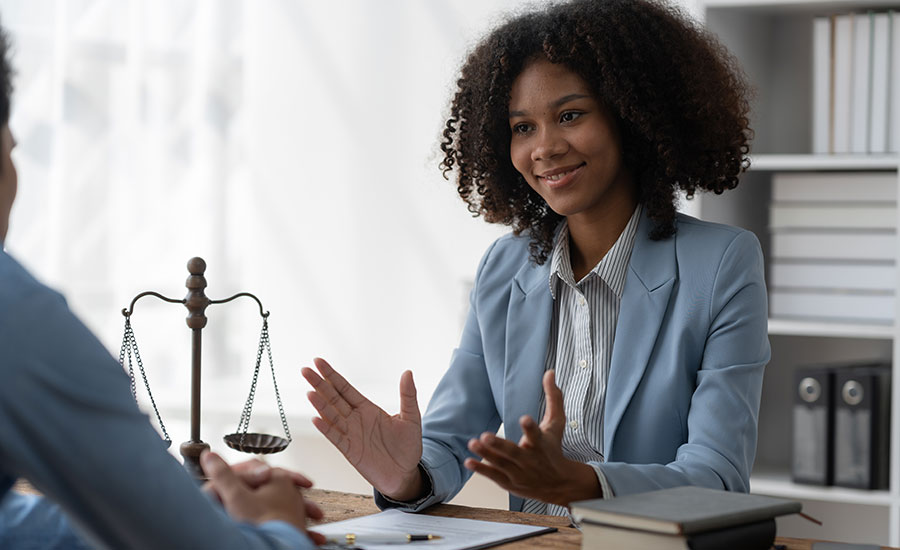 A happy couple looking at a laptop