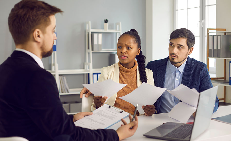 A worried Afro-American woman with an immigration lawyer