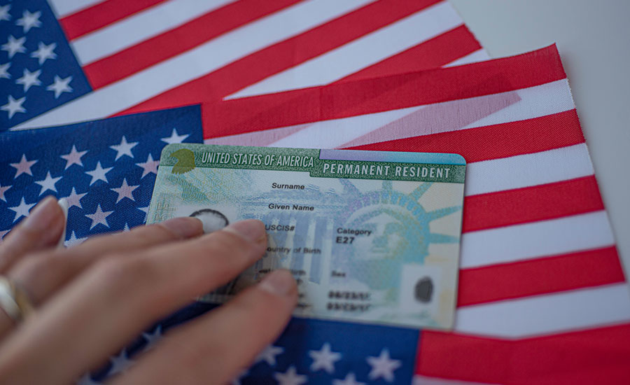 A Green Card and the U.S. flag