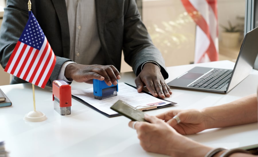 An official puts a stamp on documents