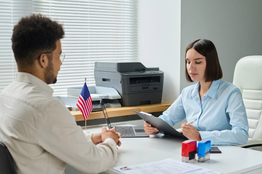 An immigration official looking at documents